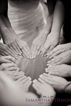 many hands are arranged in the shape of a heart