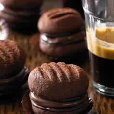 some chocolate cookies are sitting on a table