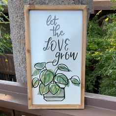 a sign that says let the love grow