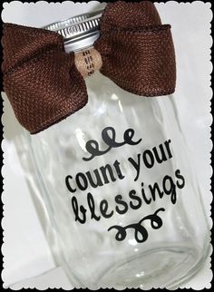 a mason jar with a brown bow on it that says, count your blessings