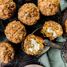 several muffins on a plate with butter and other toppings