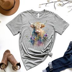 Step into a world of natural beauty with our Highland Cow Watercolor T-Shirt. Featuring a stunning Highland Cow surrounded by wildflowers, this t-shirt design brings together the grace and majesty of the Scottish countryside into one fashionable statement piece. Made with soft, comfortable fabric, this t-shirt is perfect for any casual occasion, and is sure to be a conversation starter wherever you go. Heifer Shirt, Cow Watercolor, Highland Cow Gifts, Scottish Countryside, Country Girl Shirts, Farmer Shirt, Cow Design, Sibling Outfits, Pug Shirt