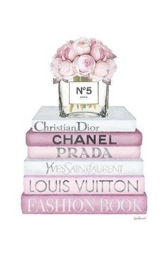 three books stacked on top of each other with a pink rose in the middle and chanel logo