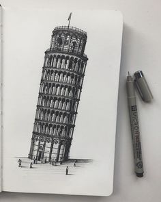 an open notebook with a drawing of the leaning tower of pisa in black and white