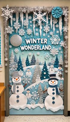 a door decorated with snowmen, trees and decorations for the winter wonderland party at school