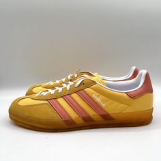 Elevate your sneaker game with these Adidas Women's Gazelle Indoor Originals in Size 10.5. The bright yellow and pink colorway adds a pop of personality to any outfit, while the suede upper material ensures durability and style. Perfect for women who prefer athletic shoes with a touch of style, these sneakers are designed with a UK Shoe Size of 9 and a US Shoe Size of 10.5. The style code, Ie2959, confirms that you are on-trend with this must-have model from Adidas Gazelle. Ideal for indoor wear, these sneakers are a comfortable and fashionable choice for any woman who wants to stay active and stylish. Yellow And Pink, Stay Active, Pumas Shoes, Adidas Gazelle, Bright Yellow, Mens Shoes Sneakers, Adidas Shoes, Adidas Women, Outdoor Activities