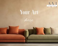 an orange and green couch in front of a wall with the words your art here