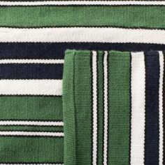 green and white striped towels folded on top of each other