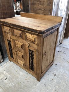 a large wooden cabinet sitting on top of a floor