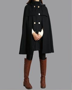 * A cool and long wool cape coat with hood, very elegant. * With double row gold color buttons and two pockets, fully lined. * If you want black buttons, please let us know, thanks. * Stand up collar, more warmer. * Material: out shell - 50% wool, 50% polyester; lining - 100% polyester * Care: dry cleanable * Shop sizing chart FYI ( made according to US sizing. actual body figures, not laying flat clothes measurements) Size XS (US 2, UK 6, German 32, French 34, ) Bust: fits bust around 33.5 inch Hooded Wool Cape For Winter, Wool Long Coat Cape For Winter, Winter Wool Long Cape Coat, Vintage Black Cape For Winter, Vintage Black Winter Cape, Elegant Solid Winter Cape, Elegant Winter Cape, Elegant Solid Color Winter Cape, Winter Wool Cape