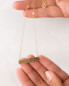 Express your love for your mama with our elegant mama bar necklace! This simple “mama” jewelry piece makes the sweetest Mother’s Day gift for mom or a new mom-to-be. Delicately engraved, our custom mom necklace serves as the perfect necklace for everyday wear. Layer this piece with our monogram disc necklace for an elegant look! Material: 14k gold filled, anti-tarnish material (will not turn blue or green and will not stain skin) Bar Size: 1.25” W x 0.25” H Chain Length: 16” with 2” chain extend Mama Jewelry, Skin Bar, Necklace For Everyday, Grandma Necklace, Engraved Bar Necklace, Turn Blue, Silver Bar Necklace, Gold Bar Necklace, Chain Extenders