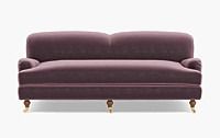 a purple couch sitting on top of a white floor