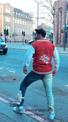 a man riding a skateboard across a street