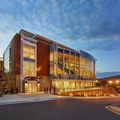 a large building with lots of windows and lights