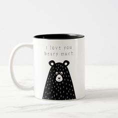 a black and white coffee mug with a bear on it's side that says, i love you beary much