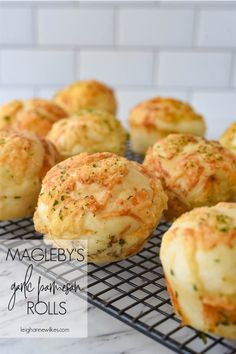 garlic bread rolls on a cooling rack with the words macieby's garlic bread rolls