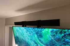 a flat screen tv mounted to the side of a wall