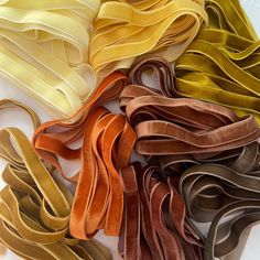 various colors of satin ribbons laid out on top of each other