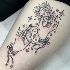 a woman's leg with a sun and moon tattoo on it