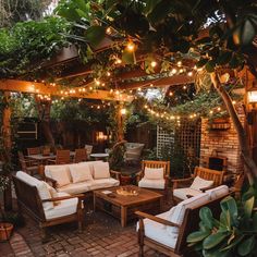 Serene garden patio with string lights, comfortable lounge furniture, and rustic wooden tables surrounded by lush greenery. Ideal for relaxation and gatherings in a natural setting. Serene Backyard, Creative Spaces, Backyard Retreat, Landscape Lighting, Backyard Decor, Backyard Patio, Creative Space, Outdoor Living, Dream House