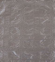 an image of a quilt that is made with metallic foil