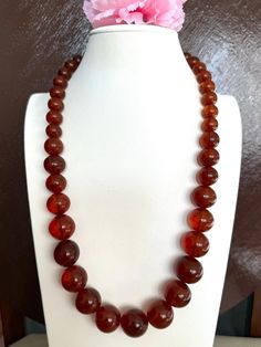 Add a touch of vintage beauty to your wardrobe with this stunning cognac color graduated genuine Amber necklace.The necklace is 25"inches long and weighs stunning 89.47grams.The round marbled shaped cognac amber beads are complemented by screw barrel clasp for secure fit ,making this necklace a perfect accessory for any occasion. This beautiful amber beads size are between 10.7mm-19.2mm. Great piece for healing purpose and for collection of this stunning vintage Amber jewelry🙏 Cognac Color, Amber Necklace, Amber Beads, Wedding Jewellery Necklace, Amber Jewelry, Vintage Beauty, Wedding Necklace, Cognac, Wedding Jewelry