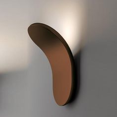 a wall mounted light that is on the side of a wall