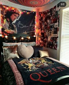 a bed room with a neatly made bed and pictures on the wall next to it