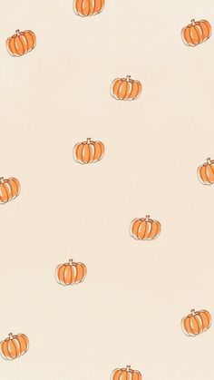 an orange pumpkin pattern is shown on a cream background with small white pumpkins in the middle