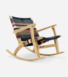 a wooden rocking chair with an upholstered seat