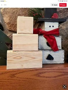 a snowman made out of wood blocks