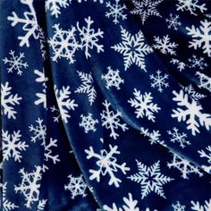 a blue and white blanket with snowflakes on it