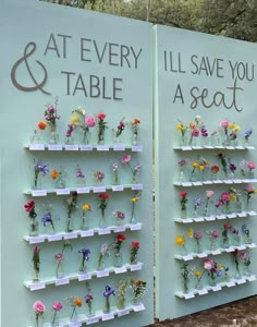 there are two signs with flowers on each shelf and the words at every table, i'll save you a seat