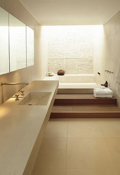 a bathroom with two sinks and a bathtub