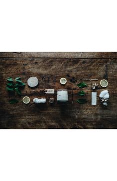 a wooden table topped with lots of different types of food on top of each other