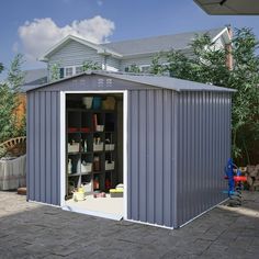 a metal shed with its doors open and shelves in the back ground next to it