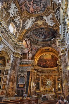 the interior of an old church with paintings on the ceiling