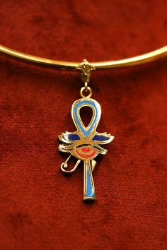 Embark on a voyage of self-discovery and spiritual enlightenment with the Ankh Key Necklace, a timeless symbol of eternal life and inner harmony. Delve into the intricate symbolism and profound meaning of this iconic necklace, which serves as a beacon of wisdom and a reminder of life's sacred journey. The Ankh Key, often referred to as the "key of life," is a revered symbol originating from ancient Egyptian mythology. Its design, resembling a cross with a loop at the top, represents the eternal Symbolic Ankh Jewelry For Meditation, Spiritual Ankh Necklace For Ceremonial Use, Symbolic Ankh Ceremonial Jewelry, Luxury Ankh Shaped Yellow Gold Necklace, Spiritual Ankh Pendant Jewelry, Traditional Collectible Ankh Jewelry, Luxury Symbolic Ankh Necklaces, Traditional Ankh Collectible Jewelry, Yellow Gold Ankh Necklace Hallmarked