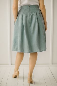 "Green Linen Pleated Skirt, Flowy Skirt, Midi Skirt, High Waisted Skirt. Every linen skirt is handmade to order.  DESCRIPTION: -High waistband -Pleats down the waist -Pockets -A-Line -Flowy -Handcrafted ETHICALLY MADE. Every linen skirt is handmade using the body measurements of the individual customer.  No factory use.  Every creative and sewing task is fairly rewarded. Color in the picture- green grey. Other colors are available. Material: 100 % softened Lithuanian linen, medium weight, 205 g/ Luxury Relaxed A-line Skirt, Cheap A-line Skirt In Solid Color, Cheap A-line Skirt For Spring, Petite A Line Skirt, Cheap Spring A-line Skirt, Cheap A-line Lined Skirt, Cheap A-line Skirt With Pockets, Cheap Classic Spring Skirt, Cheap Classic Lined Skirt