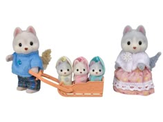 two small figurines of cats riding in a sleigh, one is white and the other has blue eyes