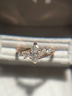 a diamond ring sitting on top of a white box