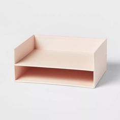 an empty pink shelf on a white background