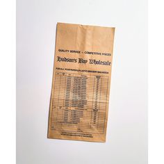 a brown paper bag sitting on top of a white table