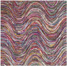 a multicolored rug with wavy lines