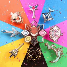 an assortment of pins and brooches on a multicolored background with stars