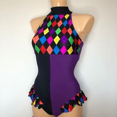 a female mannequin wearing a multicolored swimsuit