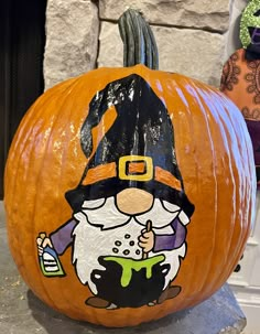 a pumpkin with a cartoon character painted on it