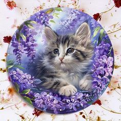 a painting of a kitten with purple flowers