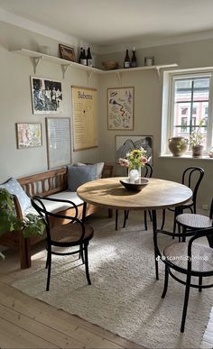 a table and chairs in a small room