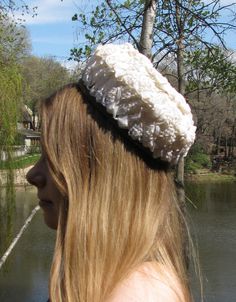 "This is a wonderful and unique hat! The label shows it is from \"filbert orcel BOUTIQUE, Paris\". This is woven ivory white colored plastic, with a straw appearance. The border is a light brown satin. This hat measures 8\" across. The height at the highest point is 3 & 3/4\". This is in excellent condition, I see no issues. Fantastic!" Cream High Crown Hat With Adjustable Fit, Cream High Crown Adjustable Hat, Adjustable High Crown Cream Hat, Vintage White Adjustable Bonnet, White Adjustable Vintage Bonnet, Vintage White Brimmed Hat, Adjustable Cream Costume Hat, Vintage White Hat, One Size Fits Most, Vintage White Hat One Size Fits Most